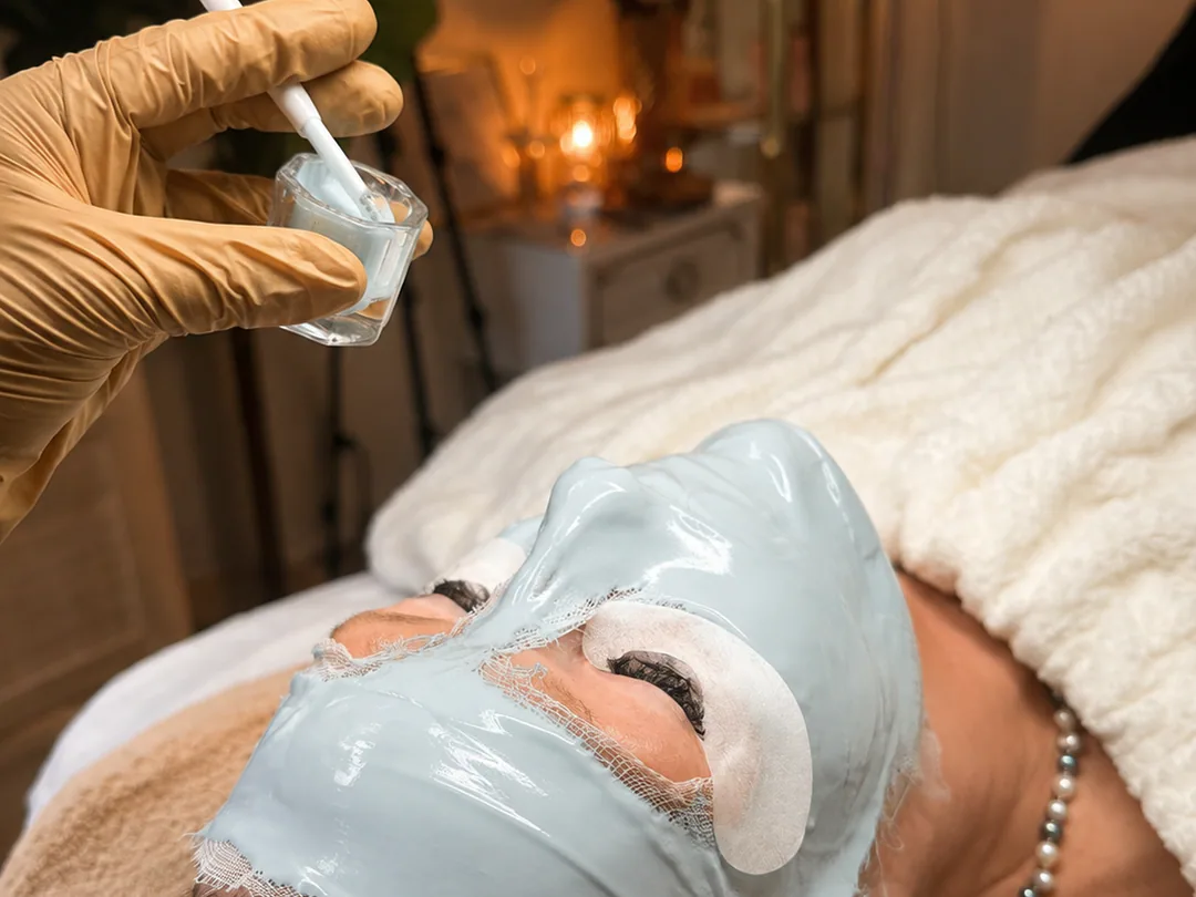 A client receiving a customized facial mask treatment at Emily SkinCare & Spa.