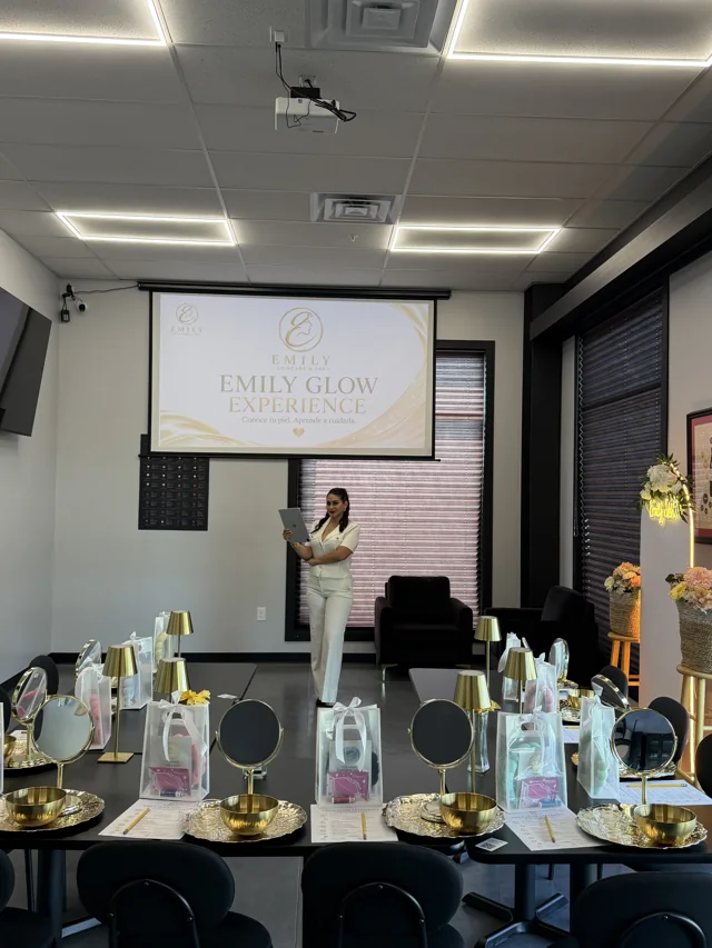 The Emily Glow Experience presentation in front of the workshop tables.